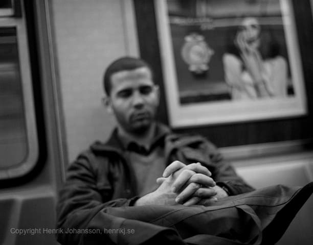 Man is resting on subway (picture taken with Canon EOS 5D Mark II and Canon EF 50mm F1.4 USM )