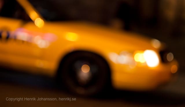 A blurry Yellow NYC cab (picture taken with Canon EOS 5D Mark II and Canon EF 135mm F2 L USM )