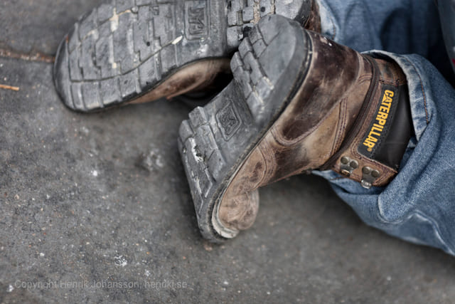 Worker in jeans and Caterpillar boots (picture taken with Canon EOS 5D Mark II and Canon EF 135mm F2 L USM )