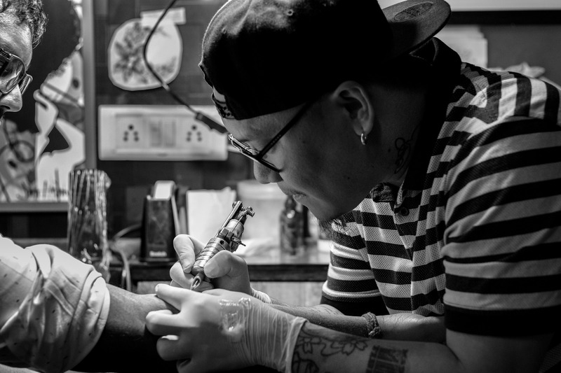 Tattoo Artist is working in his studio (picture taken with Canon EOS 7D Mark II and Canon EF 50mm F1.4 USM )