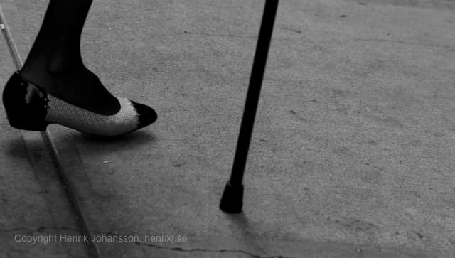 Old lady in fancy shoes with cane (picture taken with Canon EOS 5D Mark II and Canon EF 135mm F2 L USM )