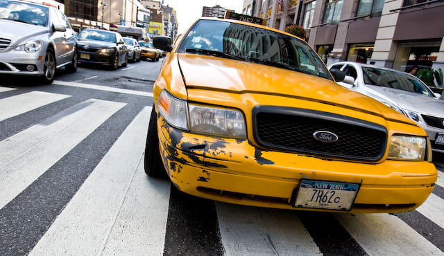 Yellow cab with damaged bumber (picture taken with Canon EOS 1D Mark III and Canon EF 16-35mm F2.8 L USM)