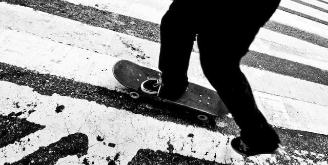 Person with skateboard on pedestrian crossing (picture taken with Canon EOS 1D Mark III and Canon EF 16-35mm F2.8 L USM)
