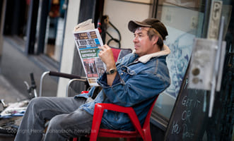 Man is reading news paper