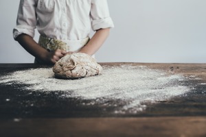 Dough and flour on table