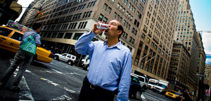 Business man drinking a Diet Coke